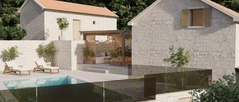 A modern house with a swimming pool, outdoor seating, and a stone facade.
