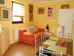 Apartment (One Bedroom Apartment) | Living room | 32-inch flat-screen TV with satellite channels