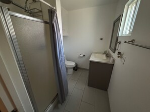 Shower, jetted tub, towels, soap