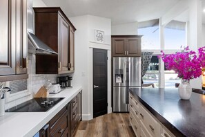 Fridge, microwave, oven, stovetop - Schatzi Haus - Home Theater, Pool, Close to Main (Fredericksburg)