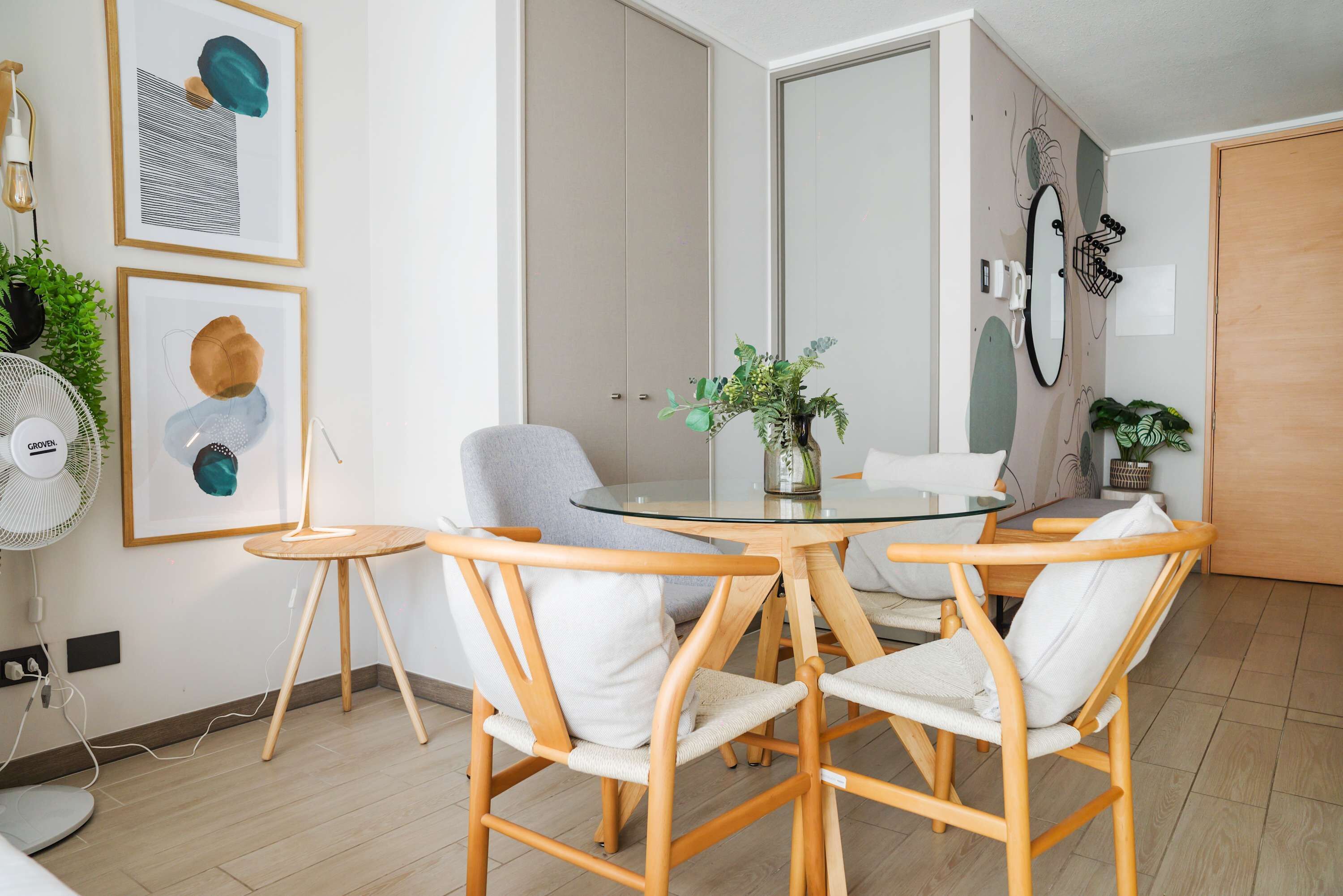 Cozy dining area with chic decor and natural light, perfect for intimate meals.