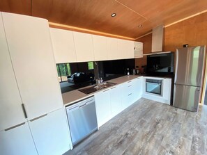 Fridge, stovetop, dishwasher, coffee/tea maker