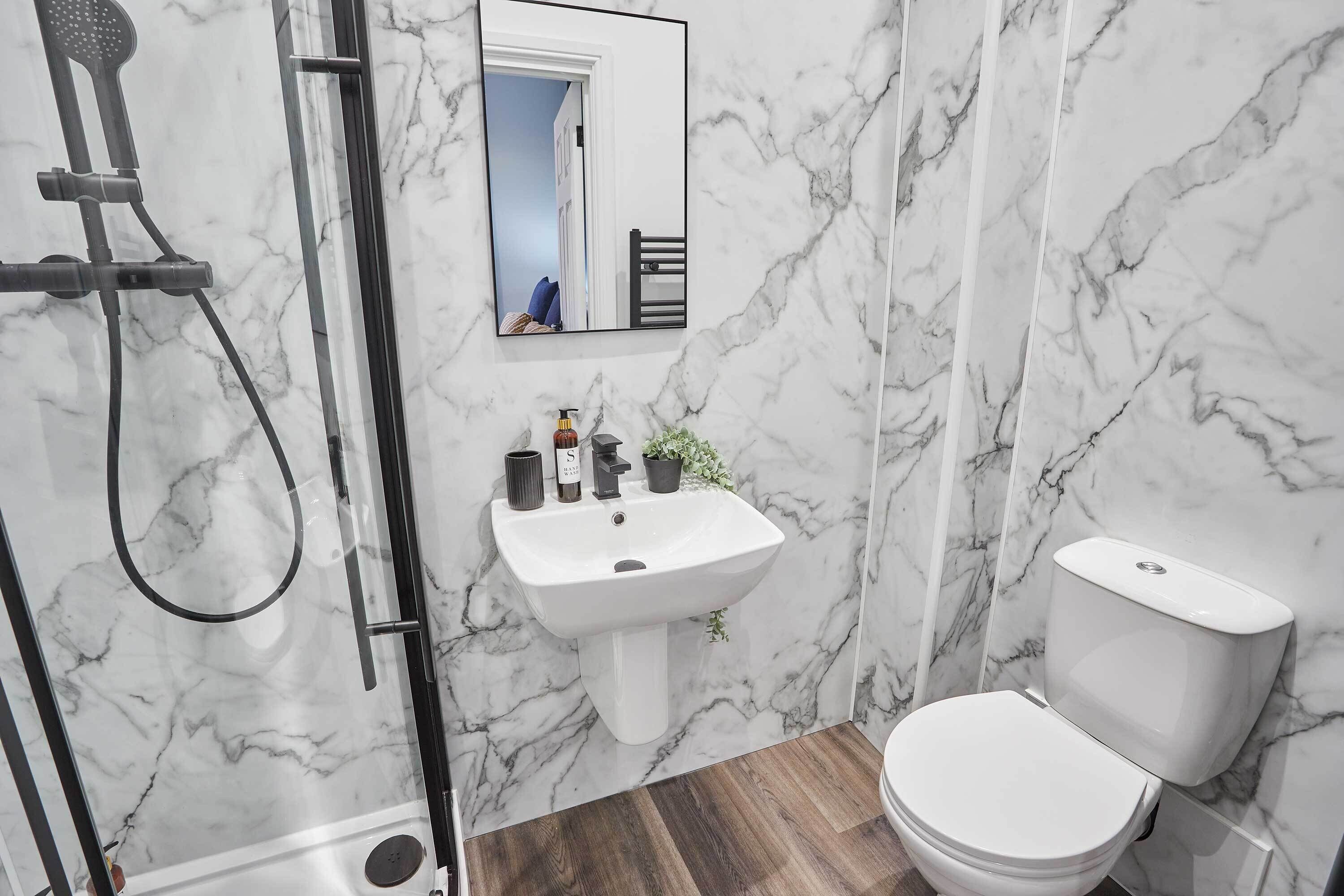 Shower, hair dryer, towels, shampoo