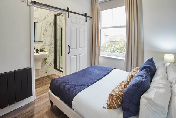 1 bedroom, desk, iron/ironing board, bed sheets