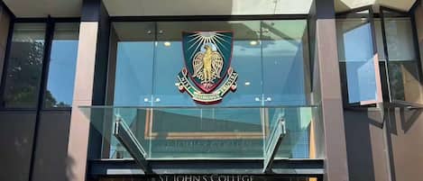 The entrance to St. John's College with a prominent crest above the doors.