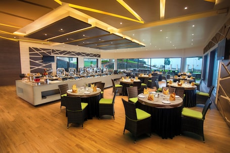 Breakfast, lunch, dinner served; Indian cuisine, garden views