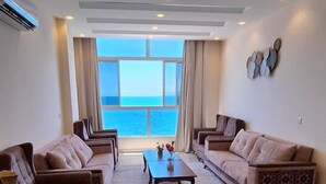 Triple Room, Sea View | Living area - amwaj hotel (Mirbat)