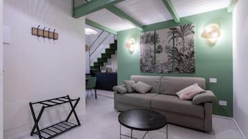 Deluxe-Apartment | Wohnbereich | Fernseher