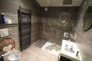 Shower, hair dryer, towels, toilet paper