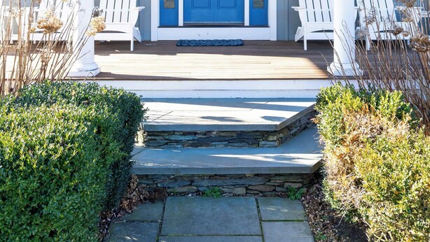 A house with a blue door, white porch columns, and two white Adirondack chairs. - Spectacular View from Rooftop Deck | Sleeps 12 (Middletown)