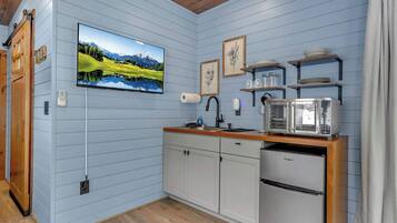 Fridge, coffee/tea maker, toaster, cookware/dishes/utensils