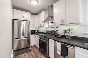 Fridge, microwave, oven, stovetop - Designer Sun Filled Condo - Walk to Town (St. Petersburg)