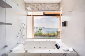Jetted tub, hair dryer, towels, soap