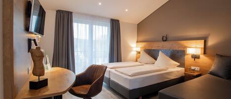 Premium bedding, desk, laptop workspace, soundproofing