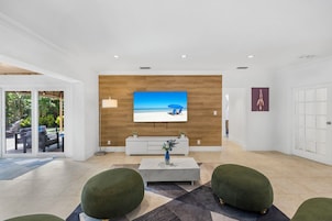 Exclusive House, Patio | Living area | 50-inch plasma TV with cable channels