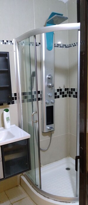 Shower, hair dryer, towels, soap