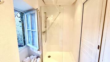 Shower, towels, soap, toilet paper