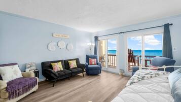 Condo, Multiple Beds, Balcony, Ocean View (By The Wave Side) | Living area | 42-inch flat-screen TV with digital channels