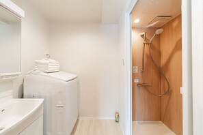 Shower, hair dryer, towels, soap