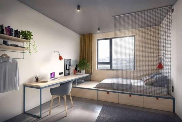 A modern bedroom with a desk, a bed with a net, a window, and a plant.