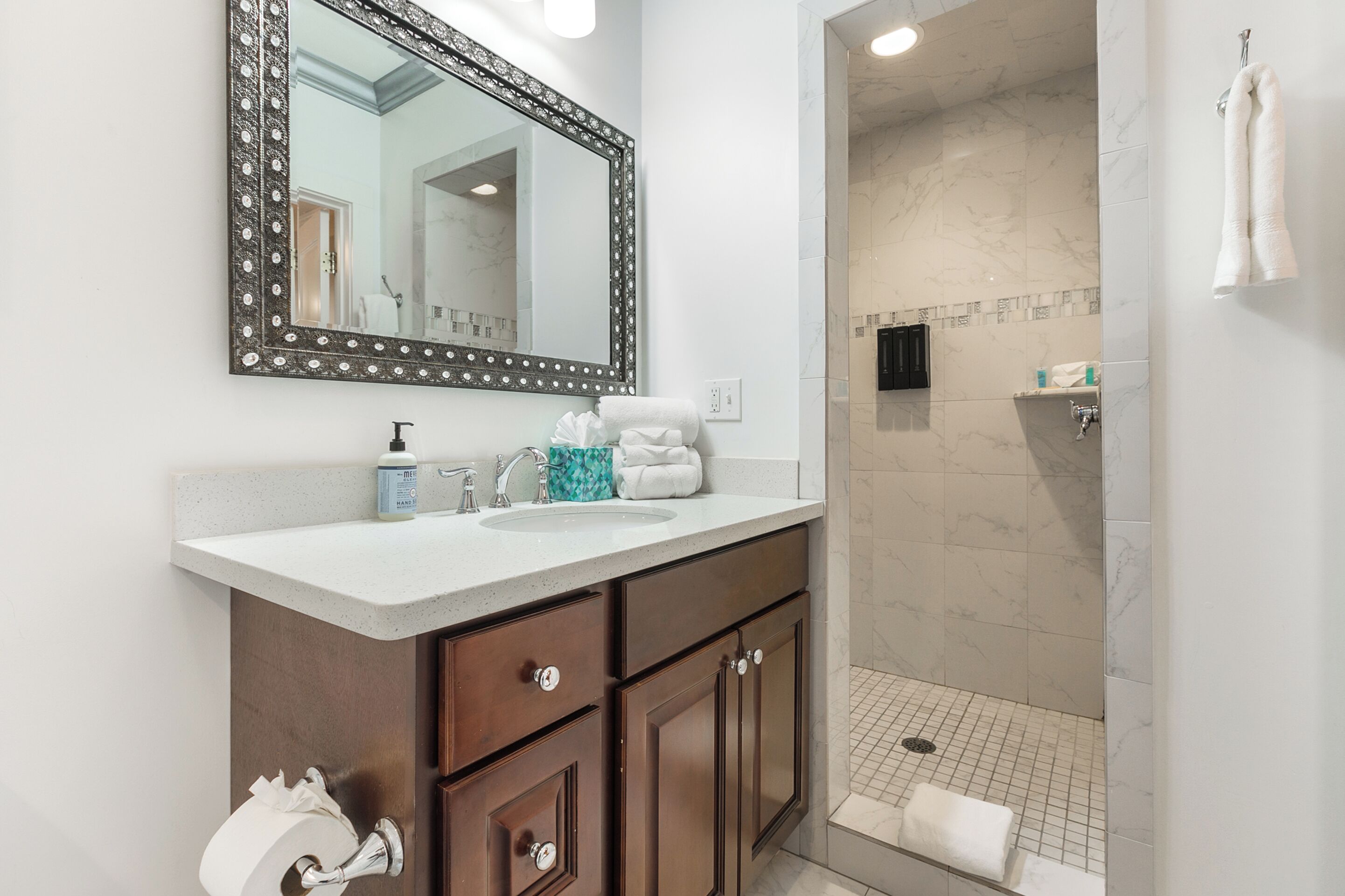 Shower, hair dryer, towels, shampoo