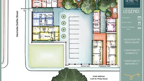 A hotel floor plan with rooms labeled by names like King Oliver, Bolden, and White. It includes amenities such as a lobby, kitchen, and emergency exit. The hotel is located at 1129 St. Philip Street. - The Shorty Guest House (New Orleans)