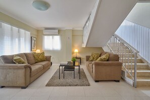 Classic Penthouse, 4 Bedrooms, City View, Tower | Living area | 50-inch Smart TV with cable channels -  Penthouse in Evaristo Morales Sleeps 14 (Santo Domingo)