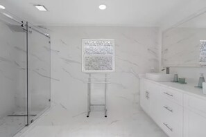 Shower, hair dryer, towels, soap