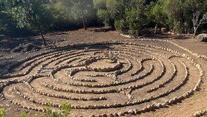 A spiral stone labyrinth in a natural setting with trees and a mountain in the background. - Mount Shasta is calling - Amazing Views- The House of Light - Pet Friendly (Mount Shasta)