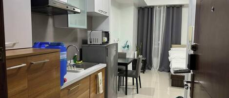 Fridge, microwave, electric kettle, cookware/dishes/utensils