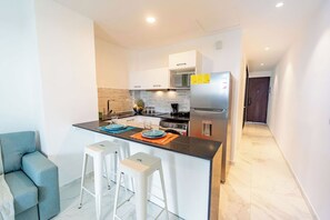 Fridge, microwave, stovetop, coffee/tea maker