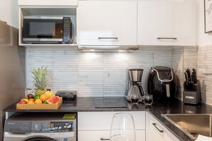 Fridge, microwave, stovetop, coffee/tea maker