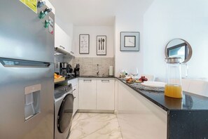 Fridge, microwave, stovetop, coffee/tea maker