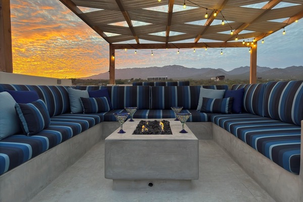 Snuggle up on the rooftop with comfy seating, breathtaking views, and a fire table for cooler nights (1)