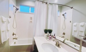 Shower, hair dryer, towels, soap