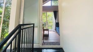 A staircase leading to a balcony with a view of greenery. - SR Villa - Serenity Riverside (Vythiri)