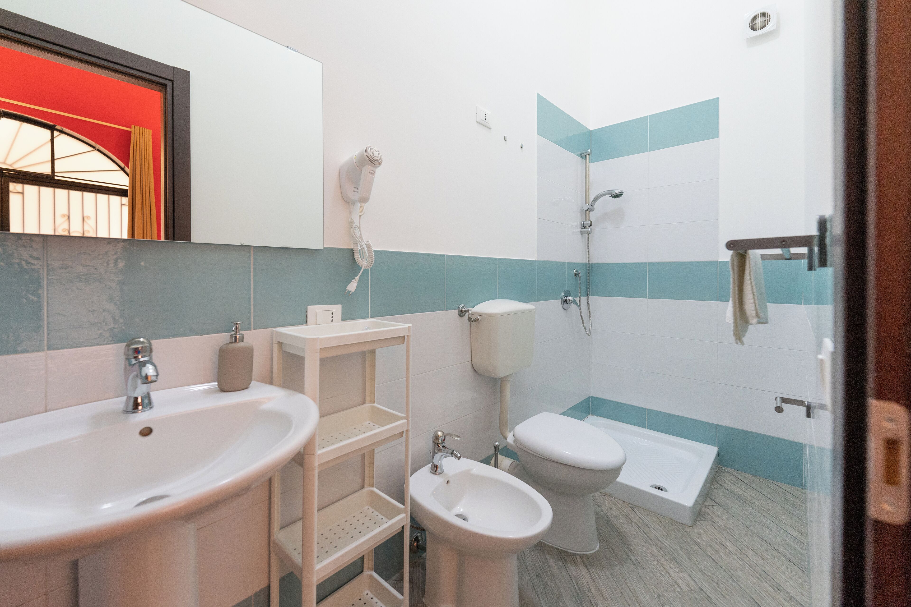 Family Triple Room | Bathroom | Shower, hair dryer, towels, soap