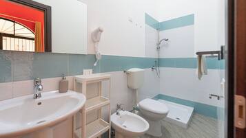 Family Triple Room | Bathroom | Shower, hair dryer, towels, soap