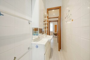 Comfort Condo | Bathroom | Shower, rainfall showerhead, eco-friendly toiletries, hair dryer