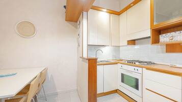 Comfort Condo | Private kitchen | Full-sized fridge, oven, stovetop, espresso maker