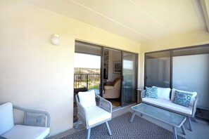 Terrace/patio - Cozy, comfortable 2 bedroom oceanfront condo with coastal decor, free WiFi, and  view of the ocean and dunes just steps to the beach! (Ocean City)