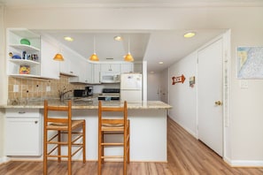 Fridge, microwave, oven, stovetop - Cozy, comfortable 2 bedroom oceanfront condo with coastal decor, free WiFi, and  view of the ocean and dunes just steps to the beach! (Ocean City)