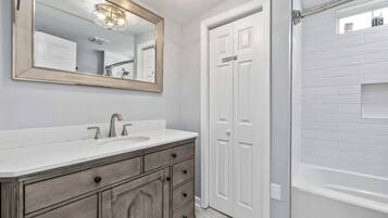 Shower, hair dryer, towels