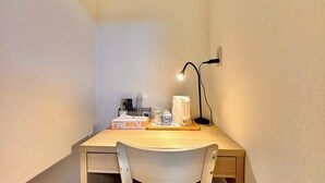 A small, well-lit workspace with a desk, chair, lamp, and various office supplies. - Along the airport line and 2 minutes from the nearest station, Japanese-style rooms with private bathrooms have excellent access [ 201]. (大阪市西成区花園北)