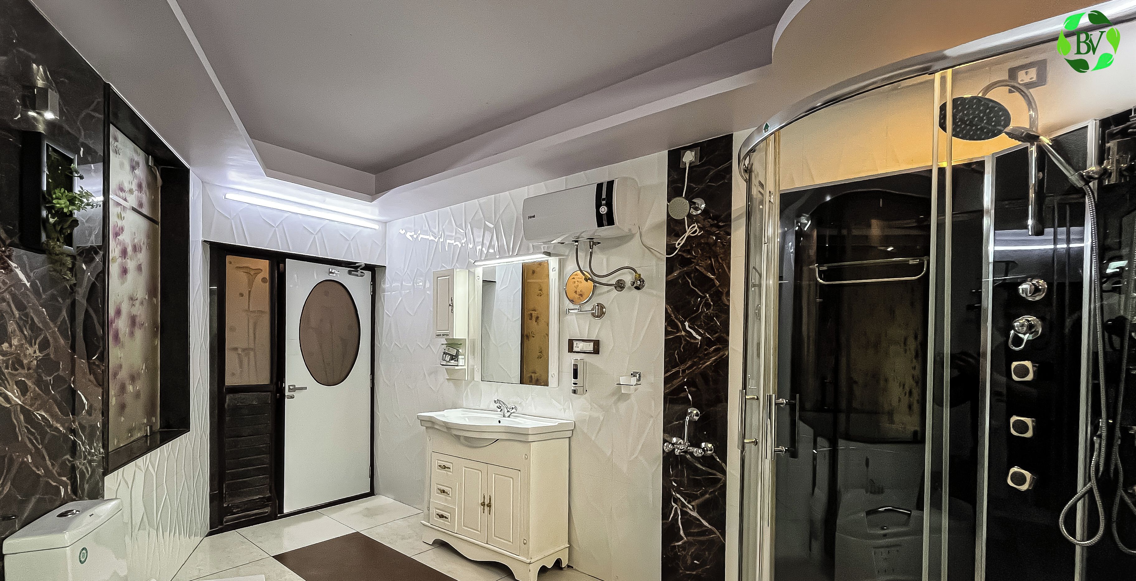 Un baño con tocador, espejo, lavabo y ducha.