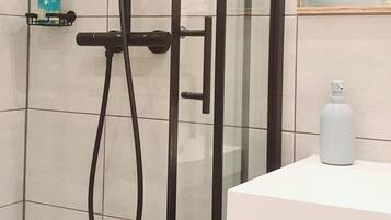 Shower, hair dryer, towels, soap