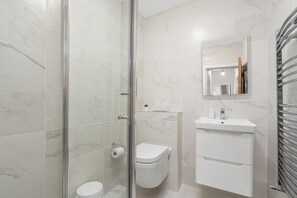 Hair dryer, towels, soap, toilet paper