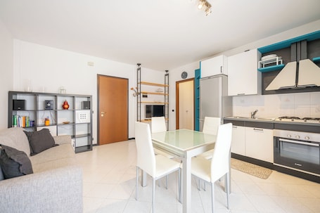 Classic Apartment, Balcony | Living area | 20-inch flat-screen TV with satellite channels