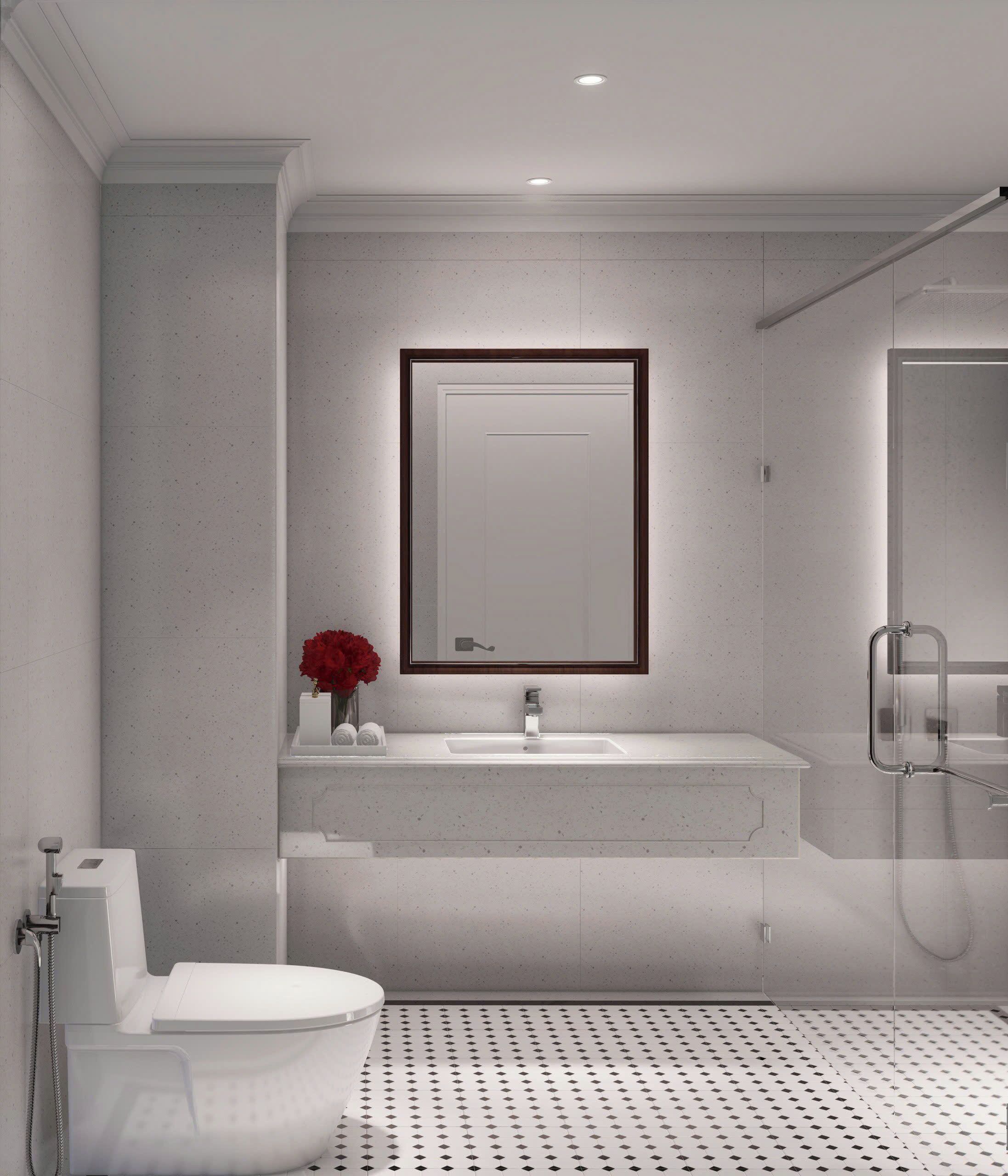 Un baño moderno con inodoro, lavamanos y ducha.