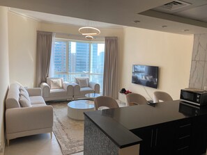 Living area - Cozy 1-bedroom apartment in lovely Sharjah with WiFi, AC, fitness room (sharjah)
